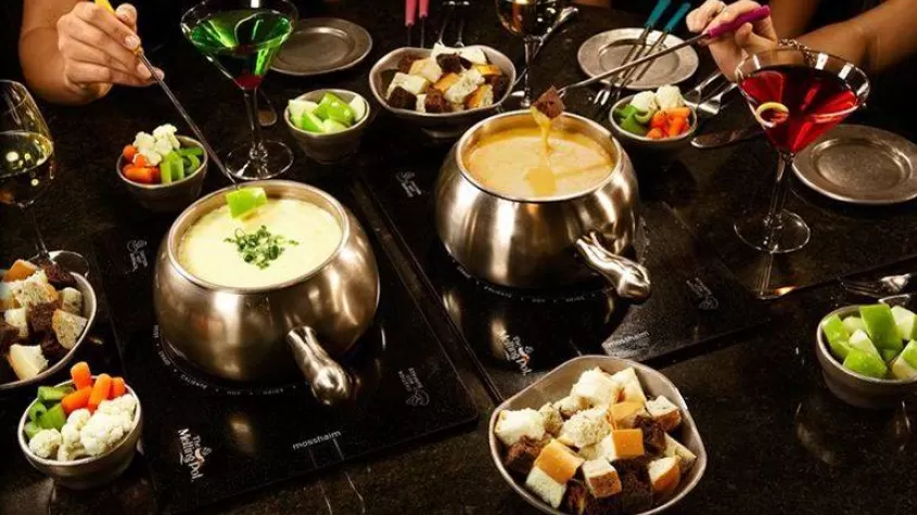 Fondue spread on dining table